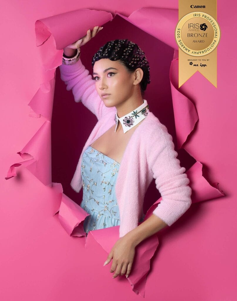 Retro-inspired pink fashion portrait with 1950s Barbie and Grease influence, hair by Jess Wilson, Apprentice of the Year finalist, Iris Awards bronze winner, photographed by Kate Ryan in Waikato, New Zealand.