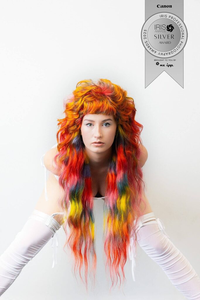 High key editorial fashion photograph with bright rainbow hair by Shannon Dowd, NZ Hair Awards silver winner, photographed by Kate Ryan in Waikato, New Zealand.